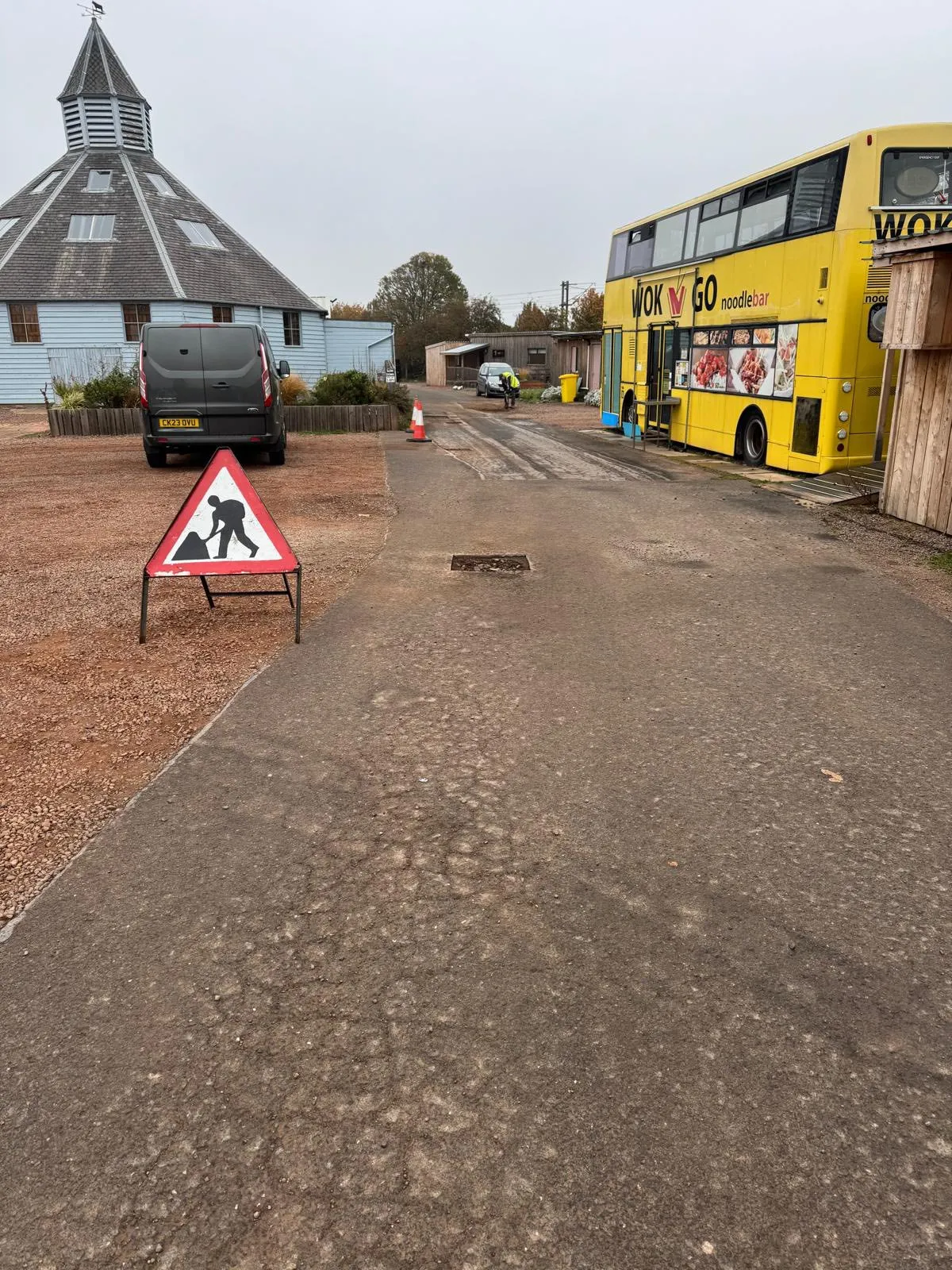 A worn tarmac surface before repair and resurfacing by E. Young Surfacing in East Lothian